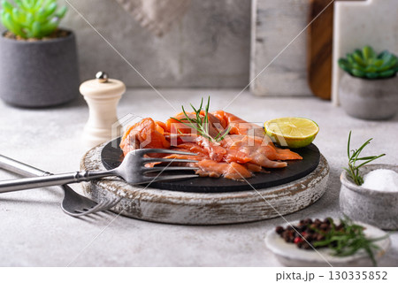 Salted sliced salmon fish with herbs 130335852