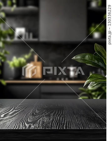 Black kitchen room background for zoom calls. Minimal dark room with wooden table in foreground 130336229
