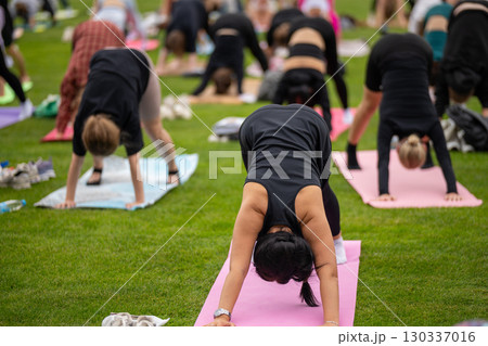 Group yoga session on stadium lawn in FYSM style 130337016