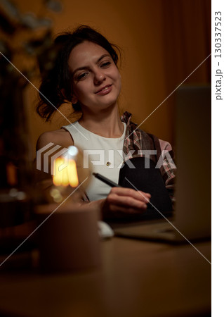 professional designer woman working at home workspace using digital graphic tablet and laptop professional designer woman working at home workspace using digital graphic tablet and laptop 130337523