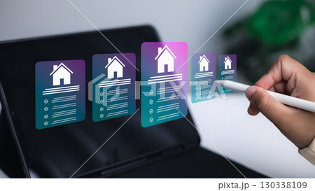Digital real estate search with futuristic housing icons on tablet screen Digital real estate search with futuristic housing icons on tablet screen 130338109