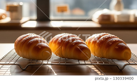 Freshly Baked Salt Bread Rolls Cooling on a Rack in a Bakery Freshly Baked Salt Bread Rolls Cooling on a Rack in a Bakery 130339400