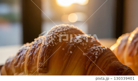 A Close Up of a Croissant with Salt Crystals in the Golden Hour Light A Close Up of a Croissant with Salt Crystals in the Golden Hour Light 130339401