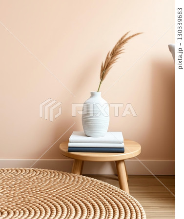 Cozy interior featuring a white vase with ornamental plants on a wooden side table, warm tones. 130339683