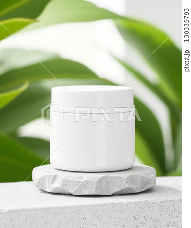 Minimalist jar on stone, surrounded by green foliage. Minimalist jar on stone, surrounded by green foliage. 130339793