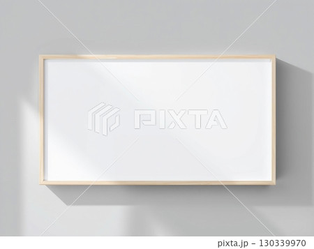 Minimalist Framed White Art Mockup on Gray Wall 130339970
