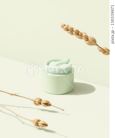 Light Green Skincare Cream Product Still Life with Plant Stalks and Shadows 130339971