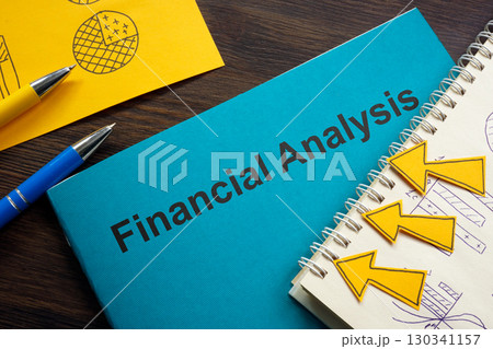 Financial analysis report on the table. 130341157