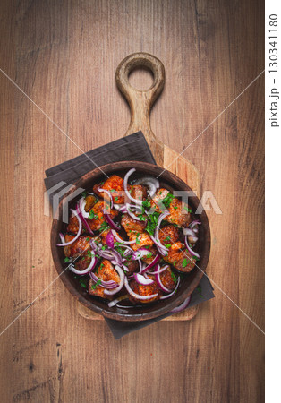 fried meat, pork kebab, ketsi in a clay pan, with red onions and herbs, homemade, no people, 130341180