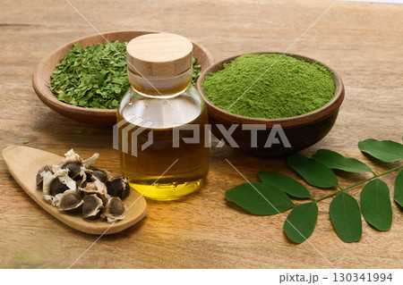 Natural Moringa Setup on wooden background Natural Moringa Setup on wooden background 130341994
