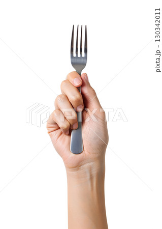 Hand holding single metal fork isolated on transparent background, basic dining utensil for culinary projects 130342011