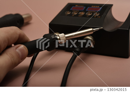 Black soldering station with hairdryer and soldering iron. Black soldering station with hairdryer and soldering iron. 130342015