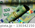 Defocused euro rolled banknote with blurry background showcasing various euro notes in vibrant colors 130342150