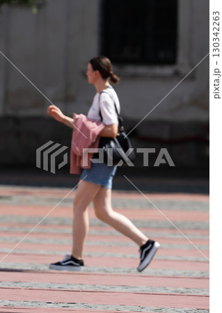 Woman walking on the street Woman walking on the street 130342263