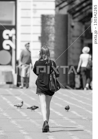 Woman walking on the street 130342265