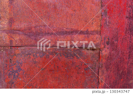 Texture of Worn red painted surface with seams, scratches and discoloration Texture of Worn red painted surface with seams, scratches and discoloration 130343747