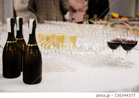 Elegant wine and champagne glasses on banquet table at luxury event or wedding reception 130344377