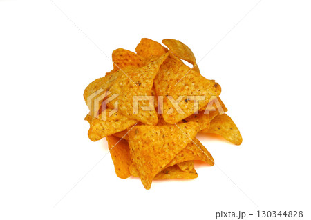 Nachos in a black bowl. Tortilla chips on wooden background. 130344828