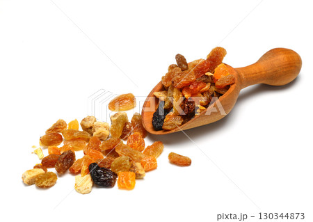 Mix of nuts and dried fruits in wooden spoon isolated on a white background. Mix of nuts and dried fruits in wooden spoon isolated on a white background. 130344873