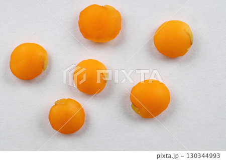 Red lentils levitate on a white background. Close up red lentil. macro. 130344993
