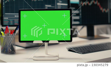 Trading software in prop firm office with graphs on isolated screen tablet. Mockup device on desk used by financial experts tracking stock market activity using analytical tools 130345279