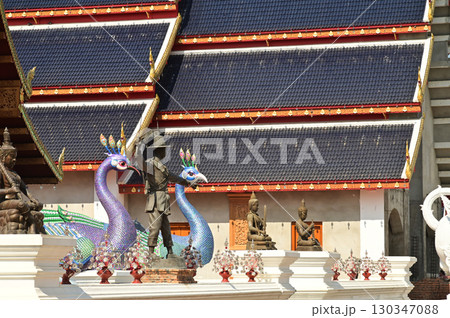 The statues of peacock and King in Thai literature are Thai art that decorate the front of the church at Wat Den Sali Si Mueang Kaen temple. Located at Chiang Mai Province in Thailand. 130347088