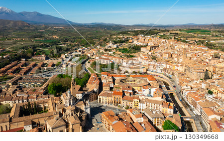 Aerial view of Tarazona cityscape with snow-capped Moncayo in background 130349668