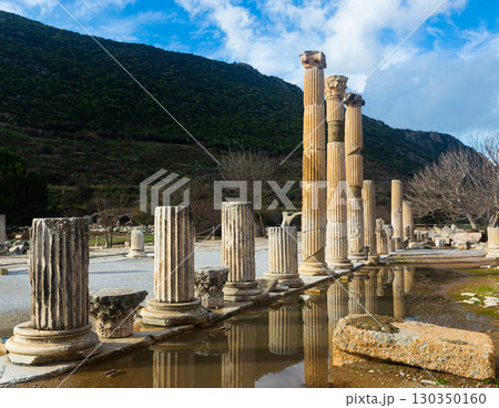Ruins of the Upper Agora at Ephesus ancient site in Turkey. View of fragments of columns; with Sacred Street and Odeon 130350160