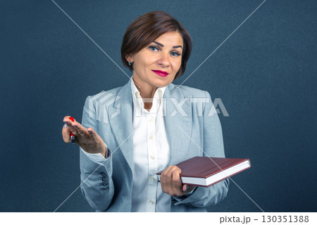 Businesswoman explaining concepts with confidence in a professional setting 130351388