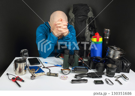 Preparing for an outdoor adventure while feeling overwhelmed by gear and supplies Preparing for an outdoor adventure while feeling overwhelmed by gear and supplies 130351686