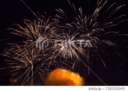 Colorful fireworks display lighting up the night sky during a festive celebration event Colorful fireworks display lighting up the night sky during a festive celebration event 130352043