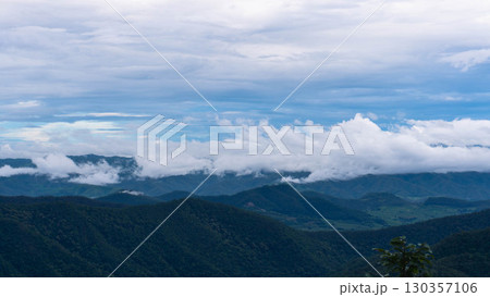 Mountain Range with Clouds and Blue Sky 130357106
