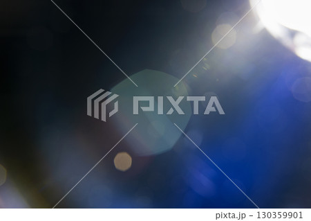 Abstract background featuring blurred, defocused light with a bokeh overlay effect, creating a dreamy and ethereal texture. Decorative element suitable for use as a backdrop 130359901