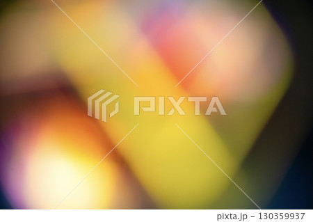 A soft and vibrant abstract background featuring a gradient of blurred colors and light leak effects. Texture or background in various designs 130359937