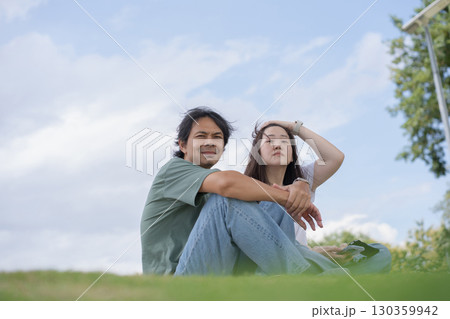Relax and wellness concept with couple sit in garden and mountain background at chiangmai thailand in raining season Relax and wellness concept with couple sit in garden and mountain background at chiangmai thailand in raining season 130359942