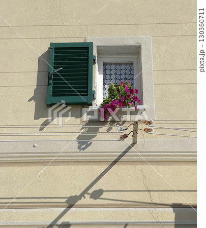 Traditional window in old house, Italy. Architecture and buildings. Clothesline for drying clothes outside. 130360711