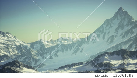 Majestic snow covered peaks rise dramatically against a clear sky at sunrise, casting soft light over the rugged terrain and emphasizing the beauty of nature in this tranquil alpine setting. Majestic snow covered peaks rise dramatically against a clear sky at sunrise, casting soft light over the rugged terrain and emphasizing the beauty of nature in this tranquil alpine setting. 130361395