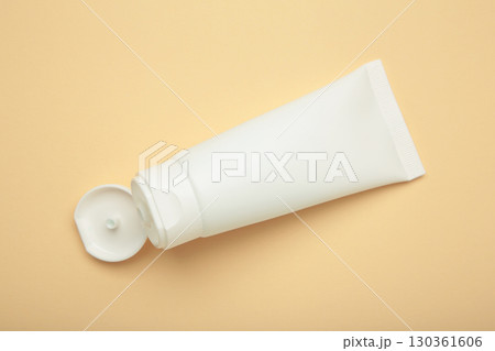 Skin care bottle cosmetic tube of beauty makeup facial on beige. Skin care bottle cosmetic tube of beauty makeup facial on beige. 130361606
