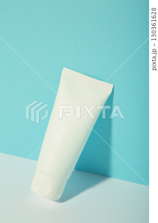 Mockup of medical skin care bottle cosmetic tube of beauty makeup facial on blue background. 130361628