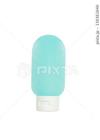 Blue travel bottle with body care cosmetics isolated on white background Blue travel bottle with body care cosmetics isolated on white background 130361640
