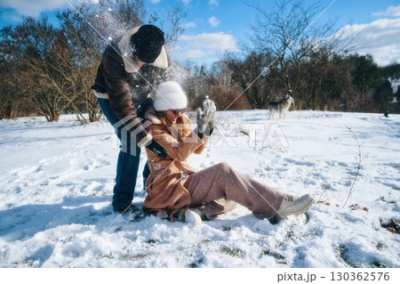 Fun winter day with friends playing in the snow outdoors 130362576