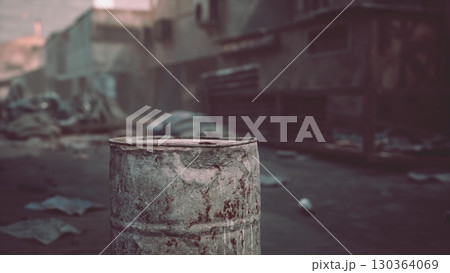 An old, rusted barrel stands alone in a neglected urban area, surrounded by debris and shadows, capturing a haunting sense of abandonment in the soft morning light. An old, rusted barrel stands alone in a neglected urban area, surrounded by debris and shadows, capturing a haunting sense of abandonment in the soft morning light. 130364069