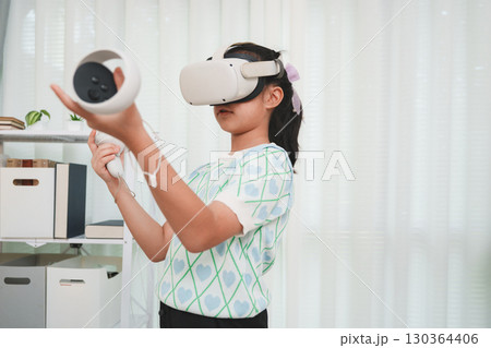 Girl Learning with Virtual Reality Headset Future Education Technology 130364406