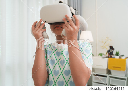 Young Girl Exploring VR for STEM Education and Gaming Fun 130364411