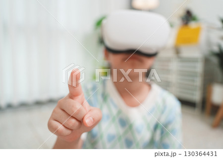 Girl Interacting with Virtual Reality by Touch Gesture 130364431