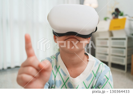 Girl Using VR Headset for Learning and Entertainment 130364433