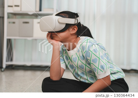 Young learner focused on a creative project in virtual reality. 130364434