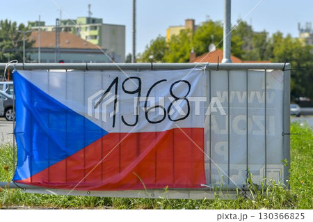 View of the Czech flag displayed on the railing. The flag shows the year 1968. On 20 21 August 1968, the Czechoslovak Socialist Republic was jointly invaded by four Warsaw Pact countries: the Soviet View of the Czech flag displayed on the railing. The flag shows the year 1968. On 20 21 August 1968, the Czechoslovak Socialist Republic was jointly invaded by four Warsaw Pact countries: the Soviet 130366825