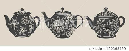 Set of teapot silhouettes with floral ornament. Hand drawn illustration. Set of teapot silhouettes with floral ornament. Hand drawn illustration. 130368430