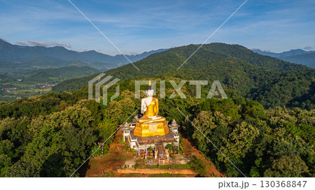 Aerial view of A golden Buddha statue on the mountains at Fang Chiang Mai 130368847